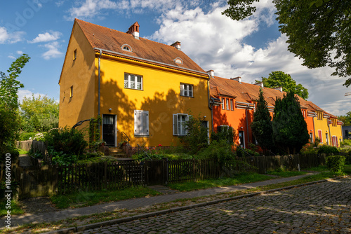 Colorful houses in the garden city of Falkenberg in Berlin