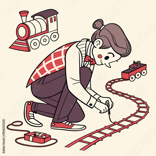 Cartoon boy playing with a toy train and its track