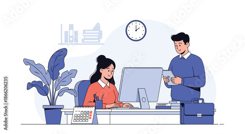 Colleagues working together at a shared desk with a computer and tablet in a bright and professional office setting.