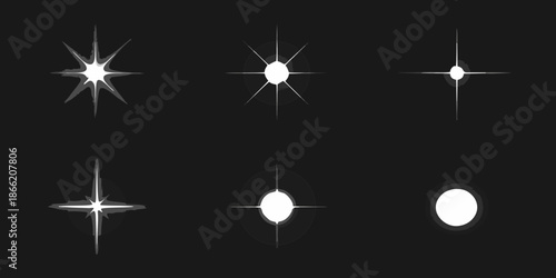 Collection of bright starbursts and sparkling light effects on black background