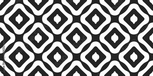 A seamless black and white geometric pattern of repeating diamond shapes