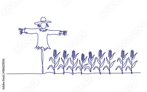 Scarecrow standing in a field of wheat with outstretched arms outstretched