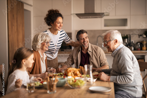 Multi-generational family enjoying a festive lunch together at home