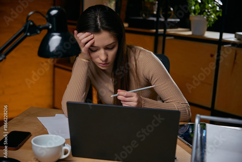 Vászonkép Woman analyzing data while suffering from decision fatigue