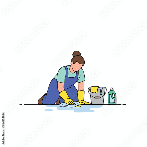 A person, kneeling, cleans a surface with a cloth, cleaning supplies next to them