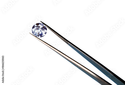 a diamond in a pair of tweezers