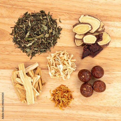 Wallpaper Mural Various dried herbs and roots arranged on a light wooden surface Torontodigital.ca