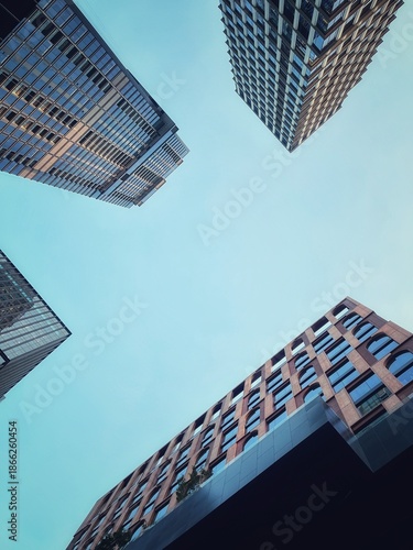 Bottom to top view four buildings from sighting person. 