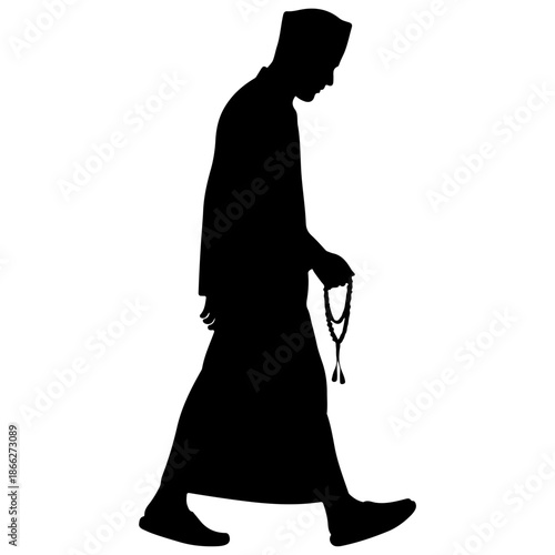 Silhouette of a Muslim man walking with prayer beads.