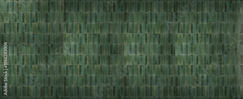 Dark green vertical ceramic tile texture with mossy color variations and vintage glossy finish for interior backgrounds.