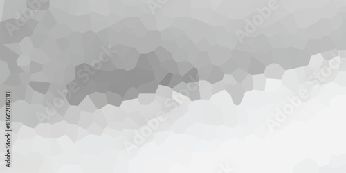 Abstract geometric background composed of irregular polygonal shapes in varying shades of gray, creating a mosaic-like effect with a smooth gradient from dark to light, ideal for modern design