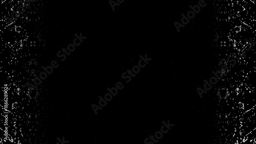 Abstract rain and snow drops falling on a black night background with glowing light. Black and white paint splash texture background with abstract liquid drops and grunge pattern illustration.