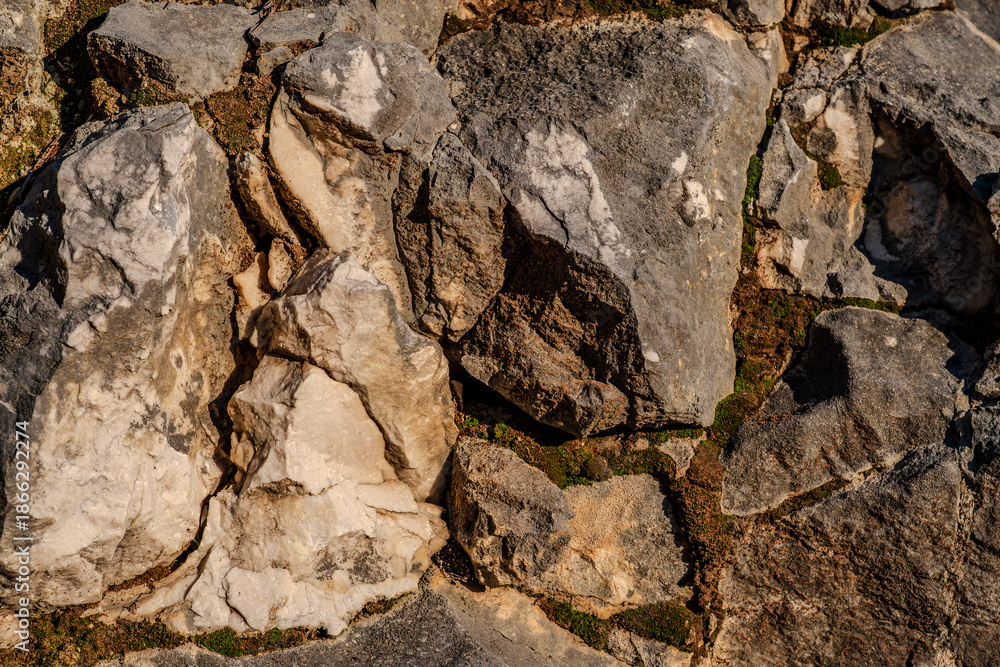 Fototapeta premium Limestone is a sedimentary rock whose main component is the mineral calcite. Limestone deposits are more or less interpenetrated by clay or quartzite impurities.