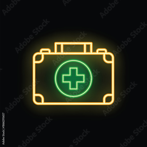 Green and yellow first aid kit sign glowing on a black background