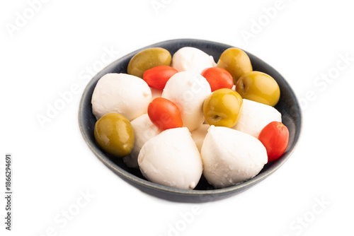 White Mozzarella cheese, with tomatoes and olives Isolated on white, side view, close up.