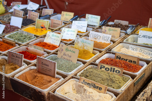 Vibrant spices and herbs displayed at a market stall
