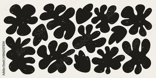 Abstract black shapes and forms arranged in a repeating pattern on a white background