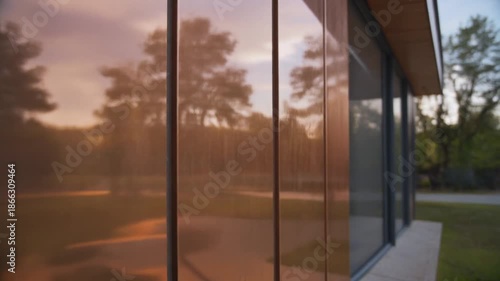 Wallpaper Mural Reflections of a Serene Sunset on Modern Glass Building Facade. Torontodigital.ca