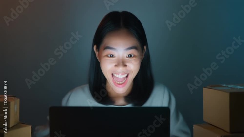 Wallpaper Mural Shocked Asian Woman Reacts to Surprising News on Laptop at Night. Torontodigital.ca