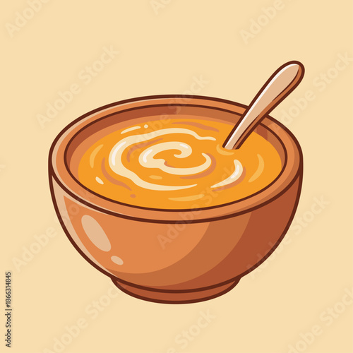 A bowl of creamy soup with a swirl on top and a spoon.