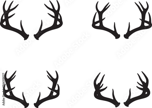 A set of four black silhouette deer antlers on a white background