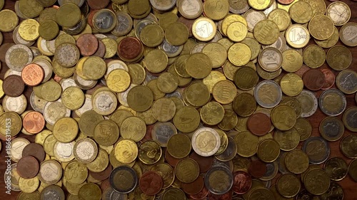 Various euro coins falling and accumulating on a dark wooden surface. Close-up view of money, wealth, and European economic concepts