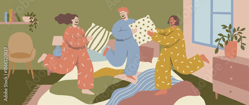 Three cheerful friends in colorful pajamas having a fun pillow fight, laughing and jumping on a bed in a cozy, stylish bedroom with plants and modern decor