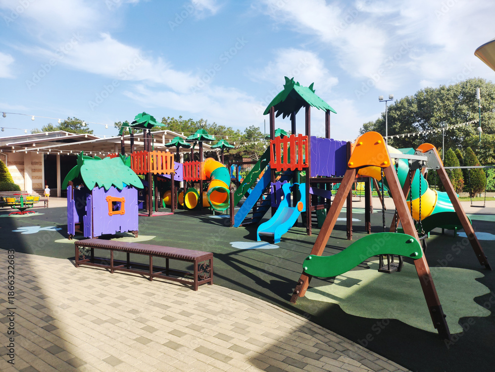 custom made wallpaper toronto digitalColorful outdoor children playground equipment; slides, tunnels, swings, climbing structures, playhouses; rubberized safety flooring; bright sunny day; blue sky; inviting recreation area