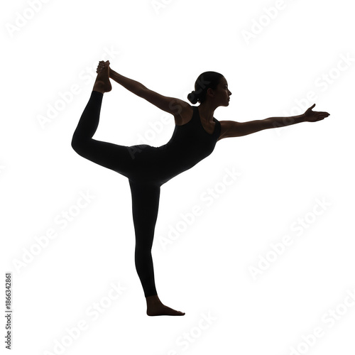 Silhouette of a woman performing a yoga pose against a black background dancer