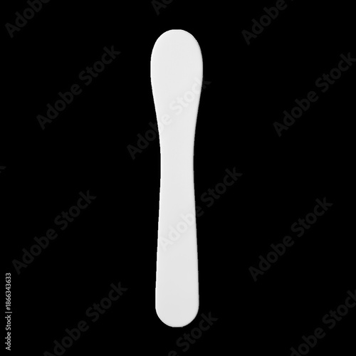 Single White Spatula Tool on Black Background image
