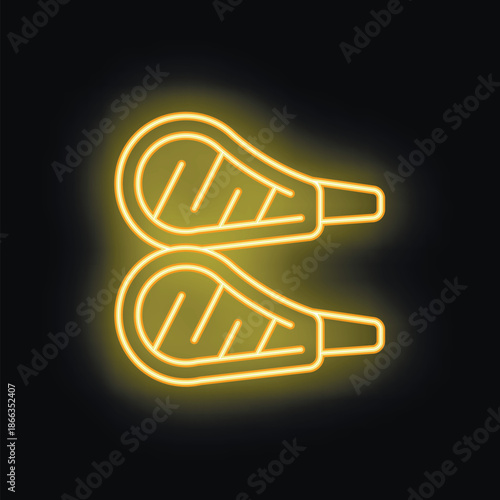 Yellow neon sign showing two grilled lamb chops, perfect for restaurant advertising