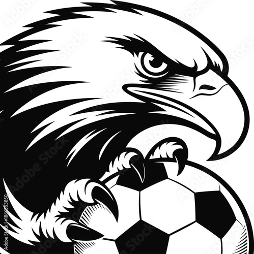 Eagle intensely gazing while clutching soccer ball