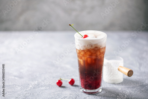 Cherry cola dirty soda in glass. Trending summer drink