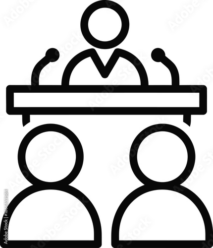 A person speaking at a podium with microphones to an audience or panel members