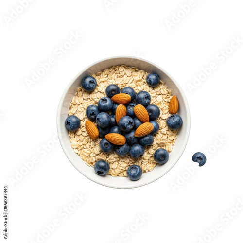 White bowl of oatmeal with blueberries and almonds on black background oats nuts