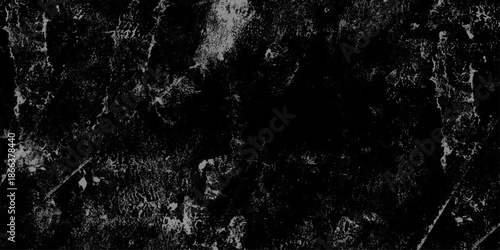 Abstract Dark black stone wall grunge aged rough texture background. closeup texture of black color. Gray concrete cracked walls in the background. White and black messy wall stucco texture background