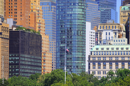 skyscrapers lower manhattan new york city and waving american flag