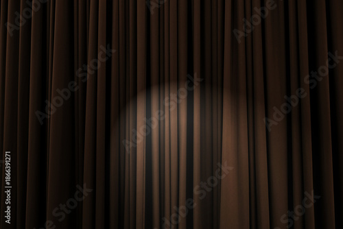 Background texture of chocolate brown, heavily corrugated curtain with stage light in the middle