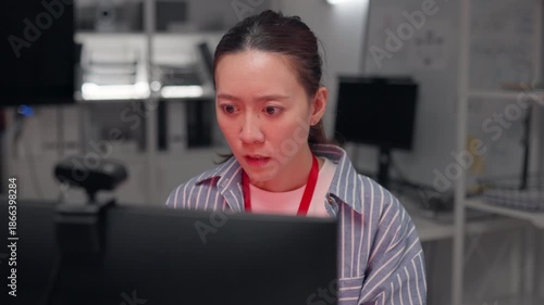 Cyber attack crisis shocked woman facing security breach, Stressed Asian woman in office reacting to hacker attack on screen. data theft risk, network security failure