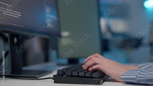 Programmer hands typing code on keyboard in office workspace. coding software development process, technology work, digital business, professional software engineering concept.