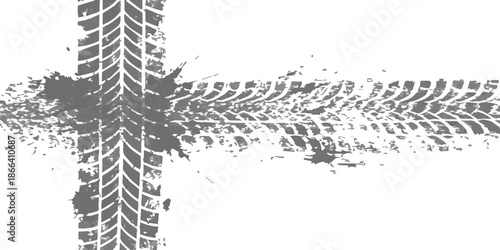 Grungy tire tracks leaving a path with muddy splatters on a white background