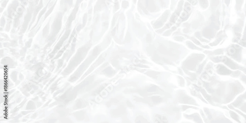 Abstract pattern of water ripples on a clean white surface with gentle light reflection