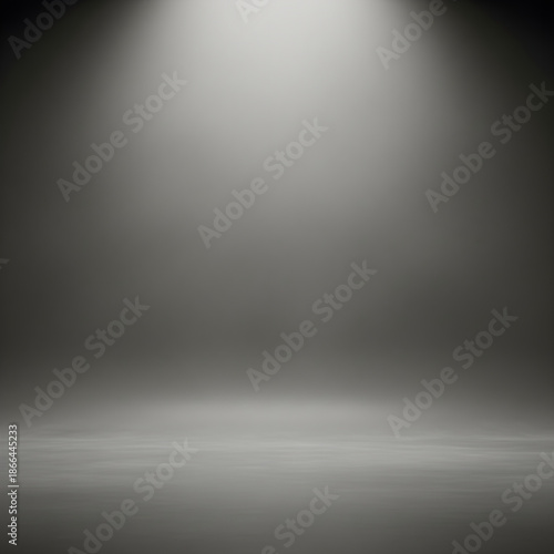 Empty dark grey concrete studio room background with top spotlight illumination, perfect for product display or abstract concepts