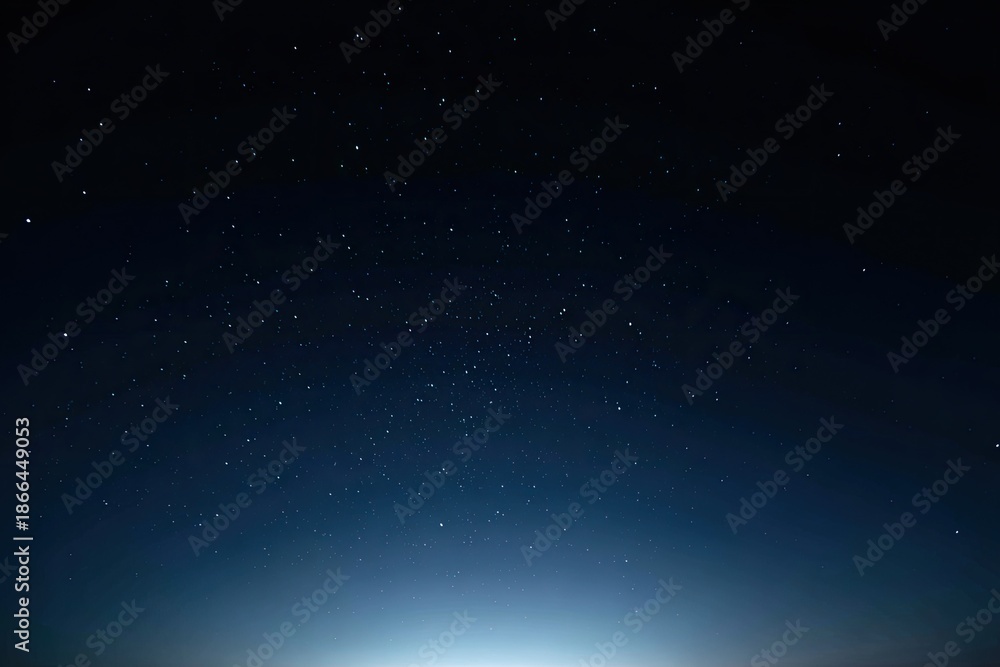 Obraz premium A dark night sky filled with countless, twinkling stars; a gradient of blue