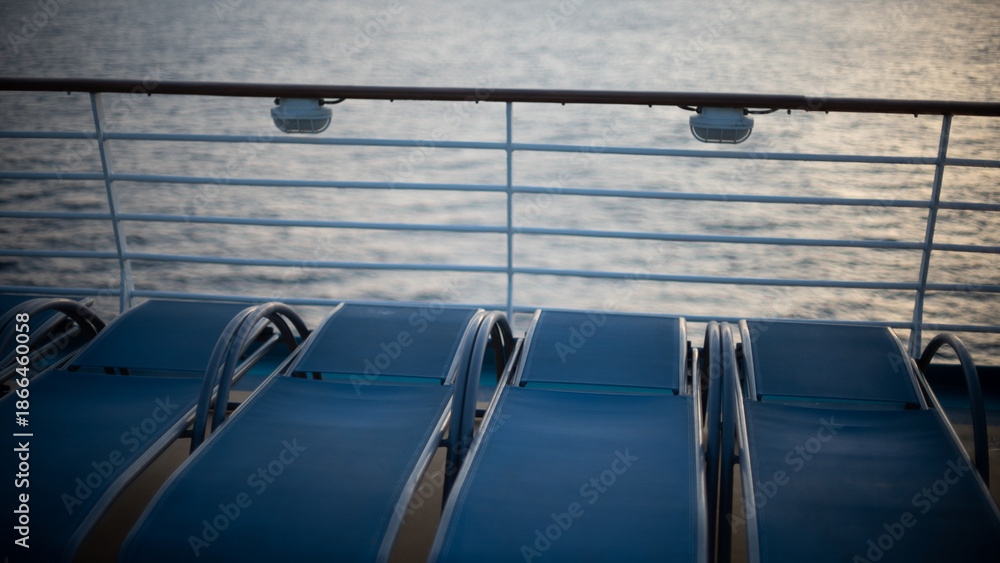 Obraz premium lounge chairs on a cruise ship inviting a vacation or retirement