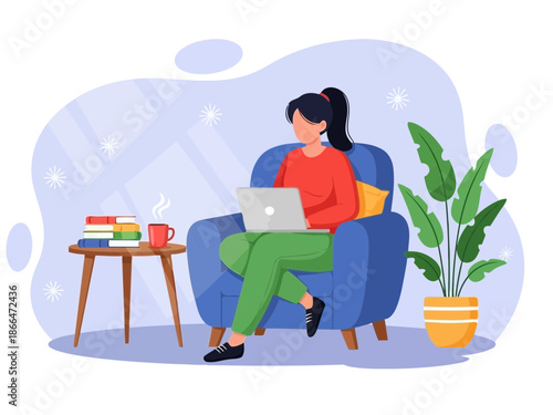 Woman sitting on blue armchair with laptop on coffee table beside her at home with plant