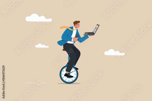 Businessman balancing on a unicycle while working on a laptop