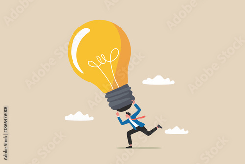 Businessman struggling to carry a giant light bulb, symbolizing the effort to bring a big idea to life