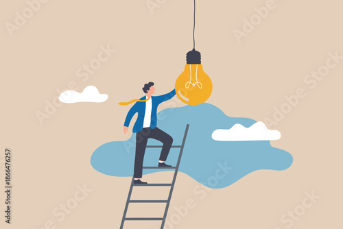 Businessman climbing a ladder to reach for a light bulb symbolizing the pursuit of success or innovation.