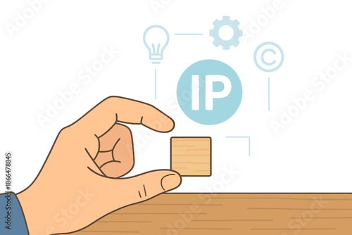 A hand holds a wooden block on a desk while an intellectual property icon appears on a virtual screen